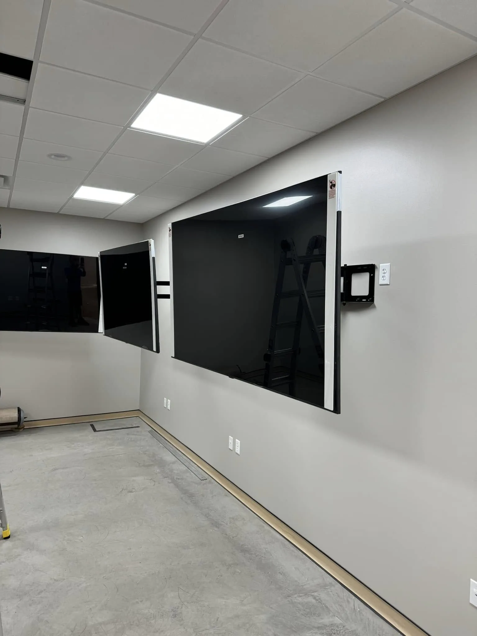 TV mounting and network infrastructure installation at medical practice operating room Cocoa FL