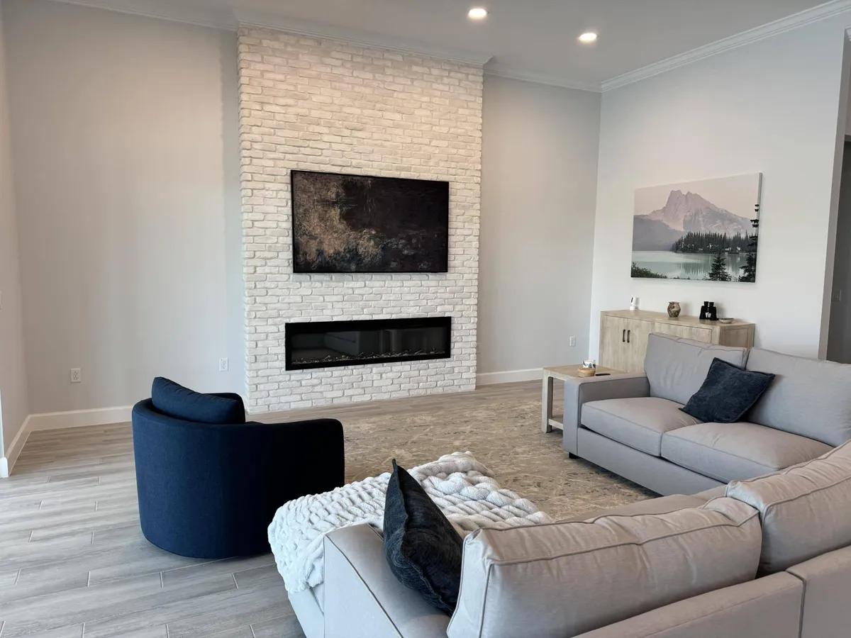Flat-screen TV mounted on a concrete block wall in a Cocoa Beach Brevard County condo